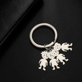 Silver stainless steel keychain with four cartoon boy and girl family figure charms - Messy Hair Boys / Silver