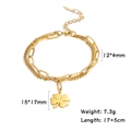Detail of gold clover charm on double-layer stainless steel paperclip and curb chain - Gold