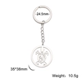 Stainless steel turtle keychain with hollow pattern and size dimensions on white background - Patterned Sea Turtle
