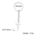 Porte-clés en acier inoxydable poli avec un pendentif évidé en forme de fée - Fée Volante