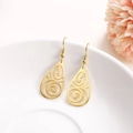 Elegant gold-tone teardrop earrings with intricate filigree pattern and polished finish - Gold