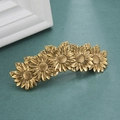 Dettaglio del fermaglio per capelli a girasole in oro vintage con petali in lega - Oro Antico