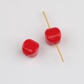 Macro shot of red acrylic cube beads with vertical holes for DIY jewelry making - Red