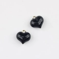 Detail view of heart-shaped black enamel pendants with gold metal hanging loops - Large / Black