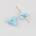 Macro detail of Y-shaped light blue acrylic beads with smooth finish for DIY jewelry making - Sky Blue