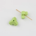 Macro detail of green Y-shaped geometric acrylic beads for DIY jewelry and crafts - Fruit Green