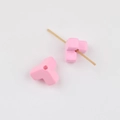Detailed view of pink triangular acrylic beads with threading holes for DIY jewelry - Pink