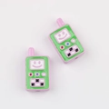 Detailed view of pink and green walkie-talkie charms with a smile for DIY jewelry - Purple