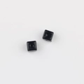 Macro detail of black acrylic square cube beads with center holes for DIY jewelry making - Black