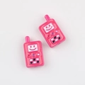 Macro detail of pink walkie-talkie shaped acrylic beads with smiley face for DIY jewelry - Rose Red