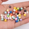Hand holding colorful acrylic cube beads for DIY jewelry and phone chain making - Random Mix