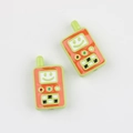 Macro detail of two colorful retro walkie-talkie acrylic beads for DIY jewelry making - Fruit Green