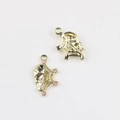 Macro shot of gold-plated alloy skull and spider web charms with pink rhinestones for DIY - Gold / Red