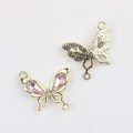Macro detail of gold bow pendant with pink stones and honeycomb texture back for DIY jewelry - Gold / Pink