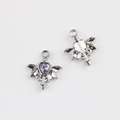 Macro detail of alloy bat wing heart pendant with purple zircon inlay for DIY jewelry - Silver Base + Purple Rhinestone