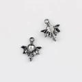Detailed view of gunmetal heart-shaped bat wing pendant with clear zircon inlay - Gun Black Base White Zirconia
