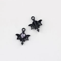 Macro shot of black alloy bat heart charms with pink zircon inlay for jewelry DIY - Black Base Purple Rhinestone