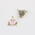 Macro detail of heart charm with faux opal and gold alloy edge for jewelry making - Gold Base Pink