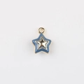 Detail of blue enamel star pendant with gold metal trim and integrated hanging loop - Gold Base Blue