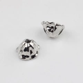 Detailed view of silver hollow flower petal bead caps for DIY jewelry making - Silver