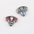 Detailed view of Gothic bat wing heart pendants with red enamel and blue galaxy finish - Gun Black Base Red