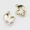 Detailed view of heart-shaped gold alloy pendants with pearls and purple zircons for DIY - Gold Base Purple Rhinestone