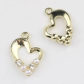 Macro detail of alloy heart charms with pearl and zircon inlay for DIY jewelry making - Gold / White Zirconia