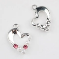 Detailed view of silver heart charms with pink rhinestones and white pearls for DIY jewelry - Bright Silver With Pink Zirconia