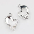 Macro detail of heart alloy pendant with white pearls and sparkling cubic zirconia stones - Silver Base with Clear Rhinestone