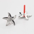 Détails macro de composants de boucles d'oreilles étoile de mer argentée pour bijoux DIY - Argent