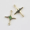 Detailed view of double-hook four-pointed star connectors with green gemstones for DIY jewelry - Gold Green Zirconia