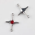 Detail of silver alloy star connector charms with red zircon inlay for DIY jewelry - Silver/Red Zirconia
