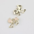 Detailed macro view of pink enamel bow charms with pearls and zircons for DIY jewelry - Gold Base Pink