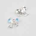 Detailed view of silver bow charm with blue enamel, pearls and zircon for DIY jewelry - Bright Silver Base Blue