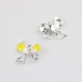 Macro detail of yellow enamel bow pendant with pearls and silver alloy textured back - Bright Silver Base Yellow