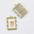 Detailed front and back view of a golden vintage angel pendant with floral texture - Gold Base Archer Angel