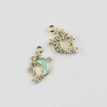 Detail of moon and star pendant with green resin and gold-plated alloy base - Gold Base Blue