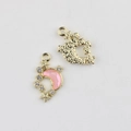 Macro shot of gold moon pendants with pink resin and rhinestones for DIY jewelry - Gold Base Pink