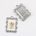Detailed view of vintage alloy angel charms showing ornate borders and textured backings - Silver Base Archer Angel