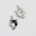 Detail of silver moon pendant with blue resin and white zircons showing both sides - Silver Base Black