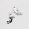 Macro detail of silver fish pendant showing S925 stamp and black zircon inlay - Silver Black Rhinestone