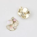Detailed macro view of enamel ginkgo leaf pendants with sparkling pink crystals and gold back - Gold Base Pink Leaf