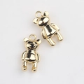 Macro detail of polished gold-tone alloy bear charm for DIY jewelry and necklaces - Gold