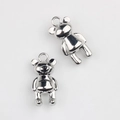Detailed macro view of silver alloy bear charms with polished finish and DIY ring loops - Silver