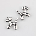 Close-up of polished silver balloon dog alloy charms with glossy mirror finish - Bright Silver (White K)