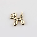 Macro detail of golden balloon dog pendant with mirror finish for DIY jewelry making - Gold