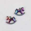 Close-up of colorful alloy rocking horse charms with honeycomb texture for DIY jewelry - Rainbow