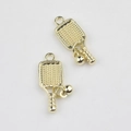 Detailed view of golden pickleball racket pendant with textured surface and small ball bead - Pickleball Paddle / Square Gold