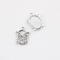 Detailed view of silver butterfly charms and oval resin bases for jewelry making - Silver Edge White Base