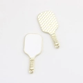 Detailed macro view showing front and honeycomb texture back of gold pickleball paddle charms - Gold Edge White